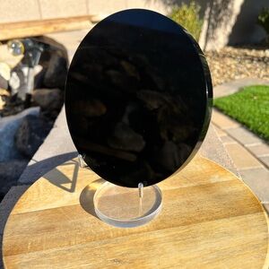 Elegant black obsidian mirror with acrylic stand 6” Diameter.